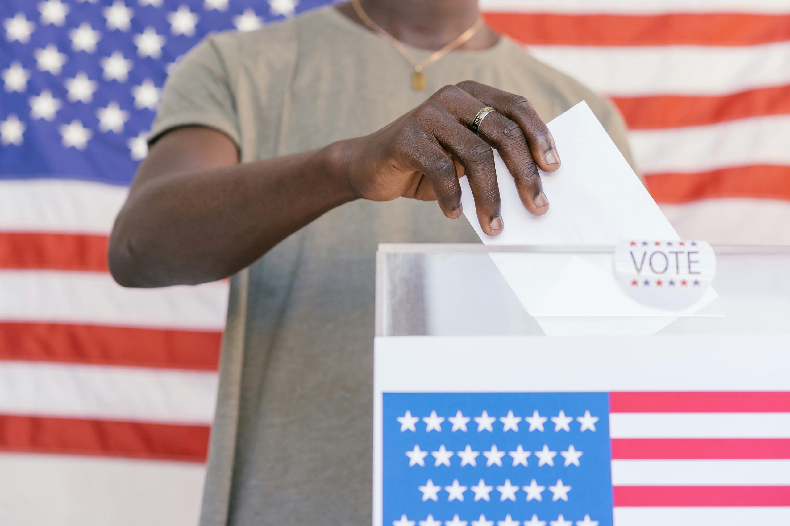 Person Putting his Vote on Ballot Box · Free Stock Photo
